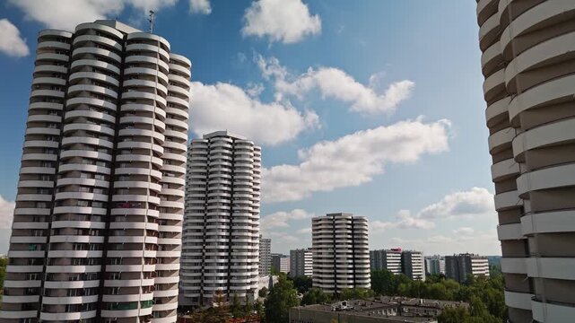 Aerial view of the iconic Kukurydze buildings, their unique curved balconies creating a striking pattern against the vibrant sky, Katowice, Silesian Voivodeship, Poland.
