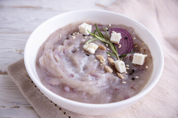 Healthy food for diabetics, starch-free. Purple potato cream soup. A nice composition with seasonings.