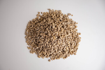 shelled sunflower seeds on a white background