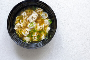 Close-Up of Molo Soup in a Black Bowl – Traditional Filipino Dish
