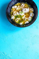Close-Up of Molo Soup in a Black Bowl – Traditional Filipino Dish
