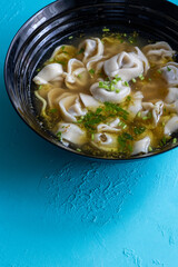 Close-Up of Molo Soup in a Black Bowl – Traditional Filipino Dish
