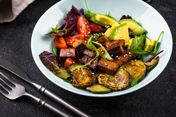 Healthy vegan keto salad with tofu and avocado