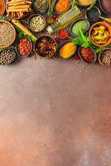 A colorful assortment of fragrant herbs and spices on a warm brown background, showcasing their visual variety and aromatic appeal