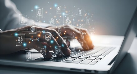 Close up of hands typing on a laptop keyboard with glowing digital data streams and futuristic icons overlayed