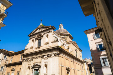 Historic roman church showcasing architectural details under a clear blue sky-Santa Maria ai Monti