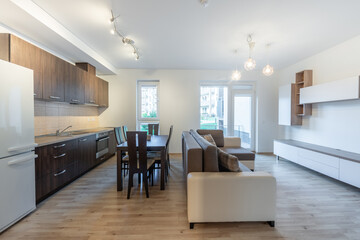 Modern Open Concept Living Room and Kitchen Area with Minimalist Interior Design. Home Interior. 