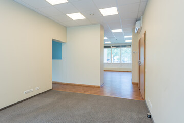 Well-Lit Empty Office Room With Large Windows and Clean Design Interior. Bright and empty office