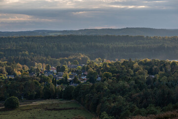 Fototapeta premium Small village in the valley from the top of the heather plantation