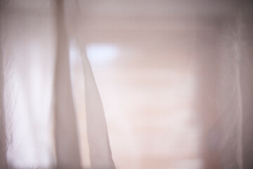 Sheer fabric texture. Translucent. Indoors.