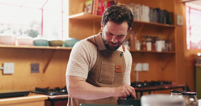 Cooking, man and tablet with mortar in kitchen to grind herbs, online recipe or hospitality industry. Private chef, tech or crush ingredients in home for meal prep, personalized menu and web tutorial