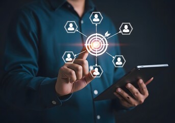 A person interacting with a digital target connected to user icons on a tablet interface screen