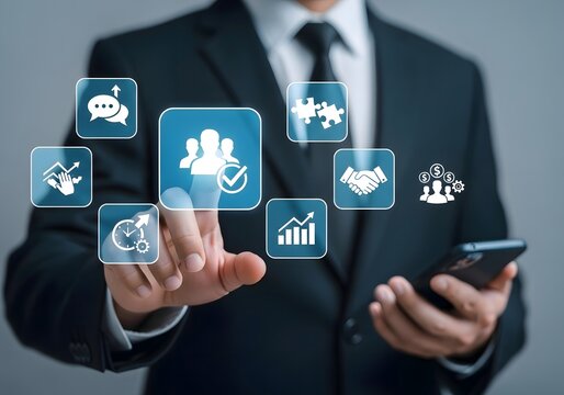 Businessman interacting with digital icons representing business concepts using a smartphone device