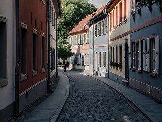 Obraz premium Charming cobblestone street lined with colorful historic buildings in a town