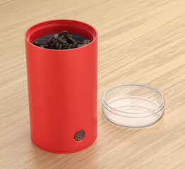 Open red electric coffee grinder with coffee beans inside on wooden desk