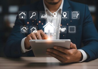 Man in suit using tablet with real estate icons floating above the screen in a blurred setting