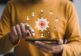 Person using smartphone with target and people icons, concept of marketing and targeting online audience