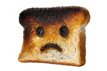 Burnt toast with a sad face carved into it against a transparent background