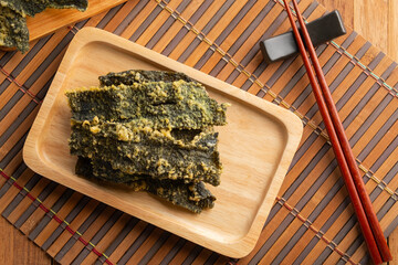 snack seaweed tempura chips,Deep fried Crispy Seaweed with flour, egg on a plate.Top view.