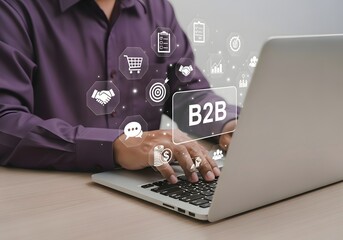 Man typing on a laptop with b to b and business icons floating around him in a digital interface