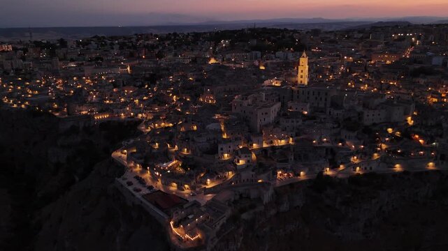 Aerial Evening View of Matera in Basilicata, Southern Italy &ndash; Historic Old Town Illuminated at Dusk