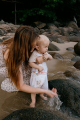 Mother and child enjoying a beach day exploring nature together