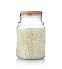Glass jar with raw rice isolated on white