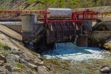 Water control structure releasing water in mountainous region