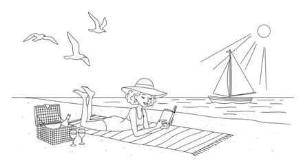 Woman reading on beach with picnic basket and sailboat in background.