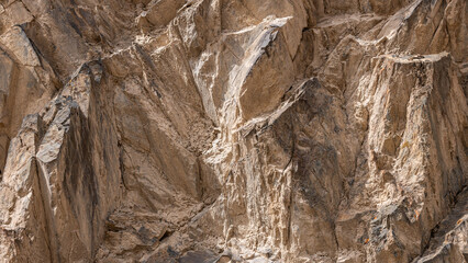 Majestic sedimentary rock formation in rugged mountainous landscape