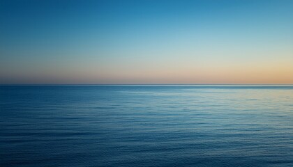 view on calm mediterranean sea and clear sky at morning before sunrise