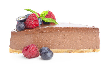 Piece of yummy chocolate cheesecake with berries isolated on white