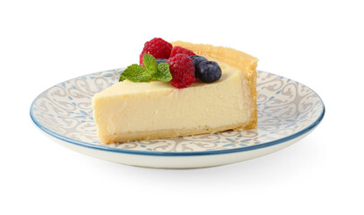 Piece of delicious cheesecake with fresh berries and mint isolated on white