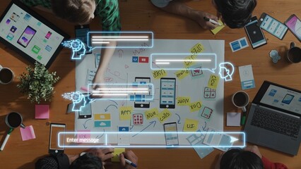A top-down view of a collaborative workspace where teams brainstorm ideas for mobile user interfaces, showcasing sticky notes, electronics, and vibrant discussions. Raster