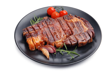 Delicious grilled beef steak with rosemary, onion and tomatoes isolated on white