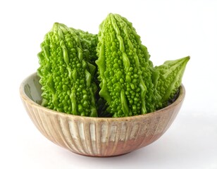 Fresh green bitter melons in a bowl