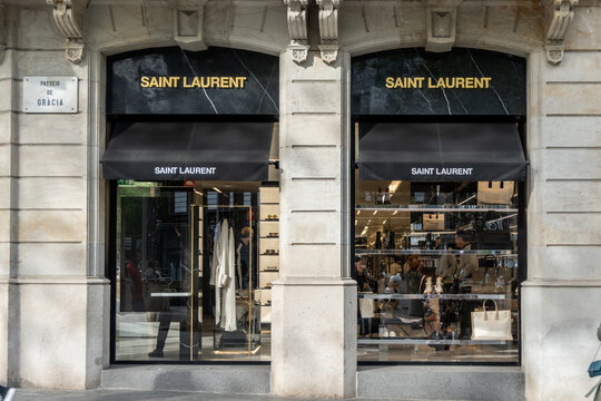 Barcelona, Spain-April 29, 2023. Yves Saint Laurent or YSL, fashion house founded by Yves Saint Laurent and Pierre Berg&eacute;. Currently its chief designer is Anthony Vaccarello. Logo on the front door
