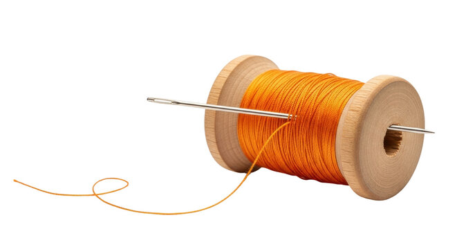 Isolated sewing needle going through a wooden spool with thread or string, a needlework tool