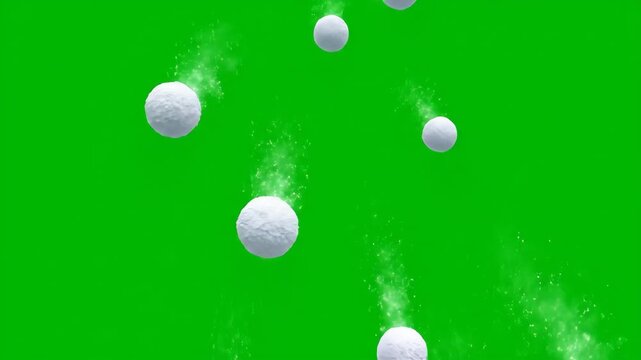 Falling Snowballs Green Screen - Multiple white snowballs fall against a bright green chroma key background, leaving shimmering trails. Perfect for adding a wintery effect to your videos.