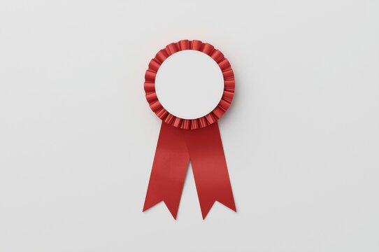 Elegant red award ribbon with blank white center for text or graphic customization