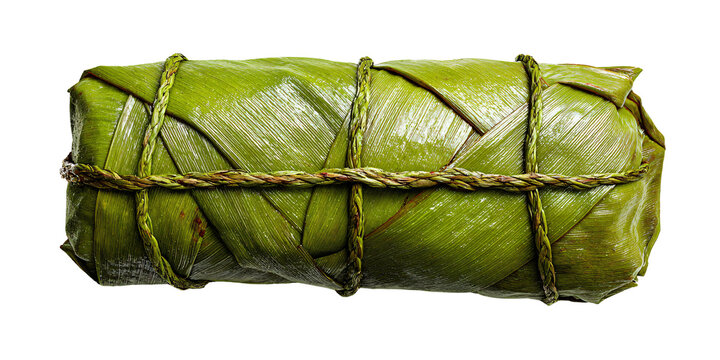 Traditional Filipino suman sa lihiya wrapped in banana leaves and tied with twine, showcasing authentic Filipino cuisine and cultural heritage