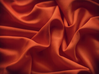 A reddish-orange wrinkled fabric texture background. Close up.