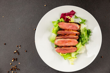 Duck breast roast poultry fresh natural product tasty snack delicious gourmet food background on the table rustic top view copy space