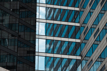 mirrored windows of the facade of an office building	