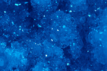 Blue Crystal Mineral Stone. Gems. Mineral crystals in the natural environment. Texture of precious and semiprecious stones. Seamless background with copy space colored shiny surface of precious stones