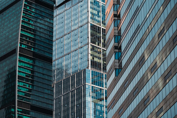 Fototapeta premium mirrored windows of the facade of an office building 