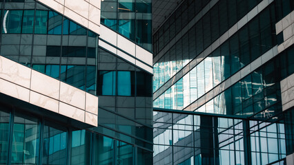 mirrored windows of the facade of an office building	