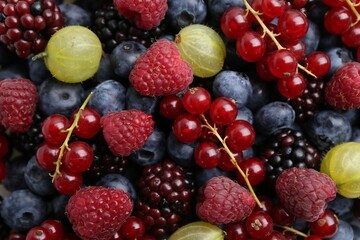 Different ripe juicy berries as background, closeup