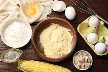 Making cornbread. Different ingredients and metal whisk on wooden table, flat lay