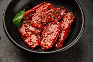 Sun-dried tomatoes snack vegetables natural product tasty snack fresh delicious gourmet food background on the table rustic top view copy space keto and paleo diet vegan and vegan food